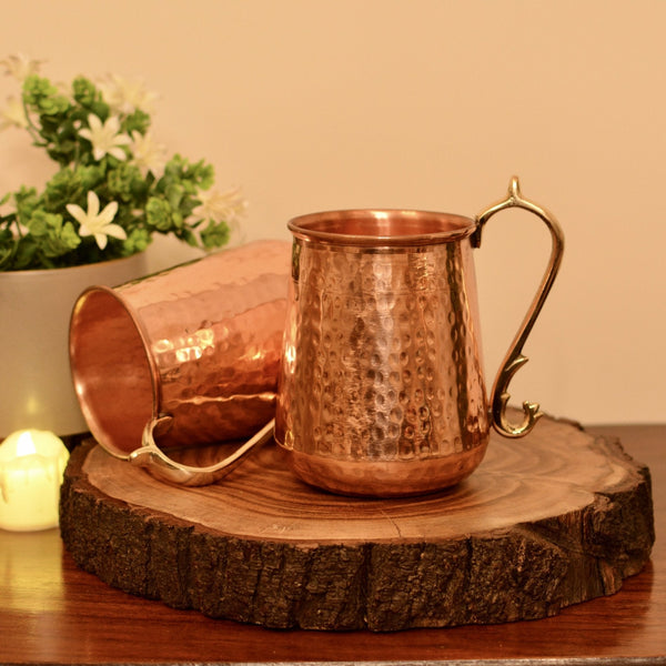 https://copperneeds.com/cdn/shop/products/oriental-copper-mug-750-ml-hand-crafted-hammered-pure-copper-885836_grande.jpg?v=1678511843
